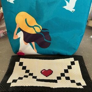 Turquoise insulated pouch with woman and Ipsy black & white heart pouch